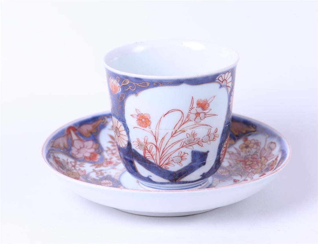 A porcelain Imari chocolate cup and saucer with floral decor in beds. Japan, 18th century: A porcelain Imari chocolate cup and saucer with floral decor in beds. Japan, 18th centuryDiam.: 15 cm.