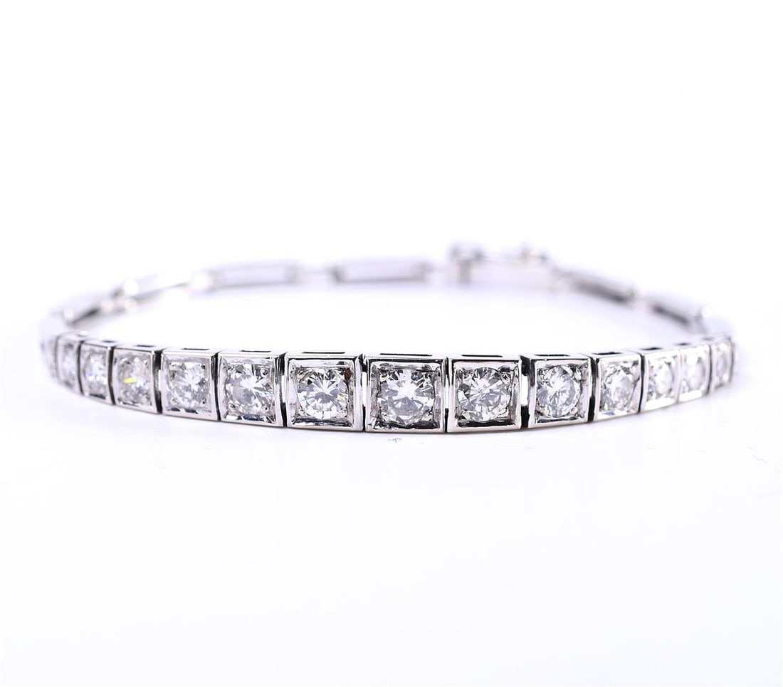 14 carat beautiful late Art Deco (1920-1940) white gold women's bracelet: 14 carat beautiful late Art Deco (1920-1940) white gold women's bracelet with a sliding clasp with extra safety eight set with 15 brilliant cut diamonds from small to large. Smallest approx. 0.06 ct.