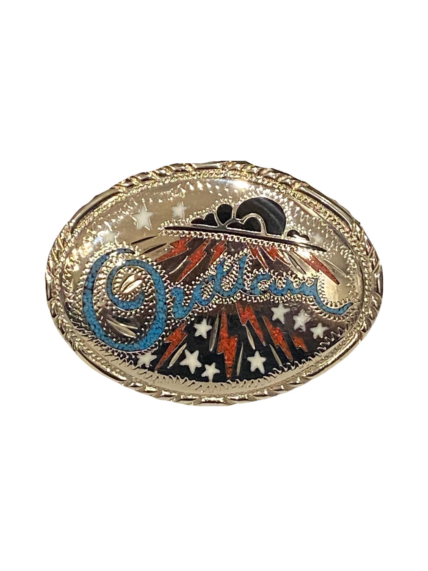 Outlaw Belt Buckle: Vintage 1980s silver tone metal, turquoise chip, coral chip and onyx inlaid novelty "outlaw" belt buckle made by S. S. I.Dimensions: 4” x 3” and weighs 5.2oz