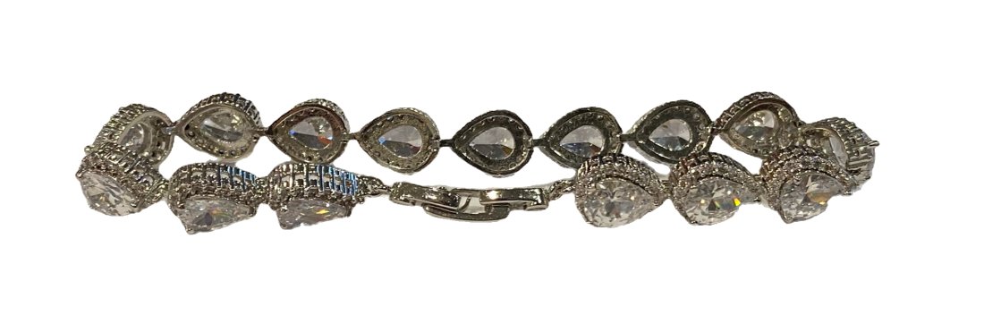 Silver Tennis Bracelet with Glass Stones: 2000s Silver tone tennis bracelets with faux glass stones: pear-cut clear stone links.Length: 7”