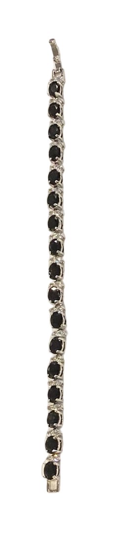Silver Tennis Bracelet with Black Stones: 2000s Silver tone Tennis bracelet with oval-cut black stone, possibly black hematite, links.Length: 7”Weight: 15.4g
