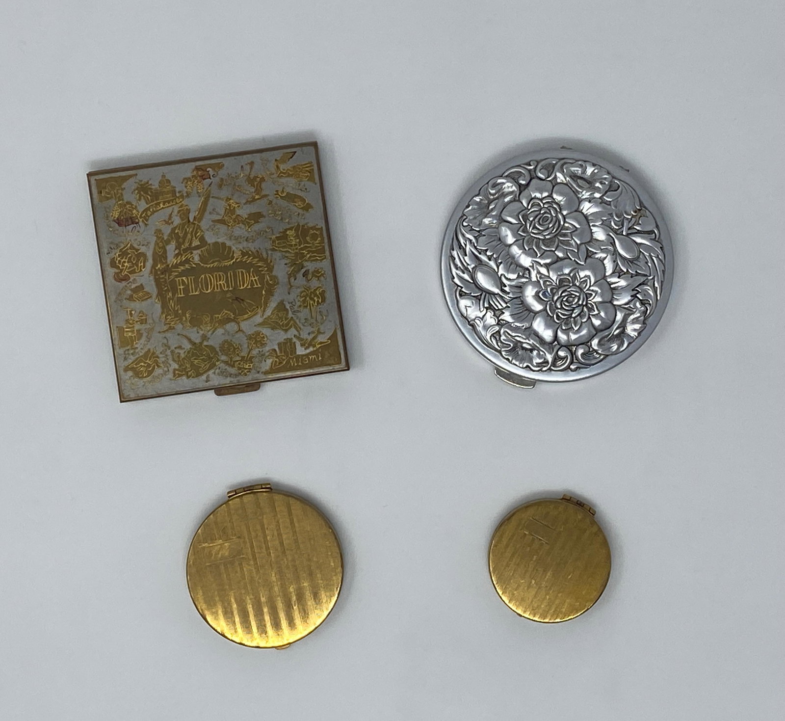 Collection of Vintage Volupte, Tre-Jur, and Gold Tone Compacts: Collection of Vintage Volupte, Tre-Jur, and Gold Tone Compacts