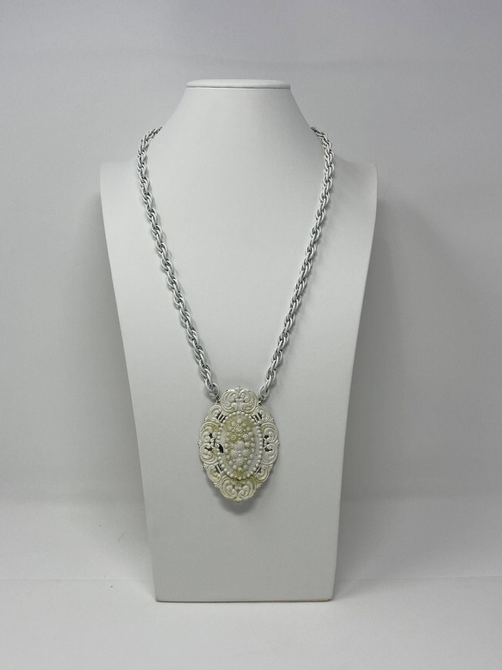Vintage Signed Freirich French Repousse' Necklace: Vintage Signed Freirich French Repousse' Necklace. French White Enamel Metal Oval Repousse Floral and Scroll Work on a Triple Link White Chain. Marked with Freirich Tag. $40-$45