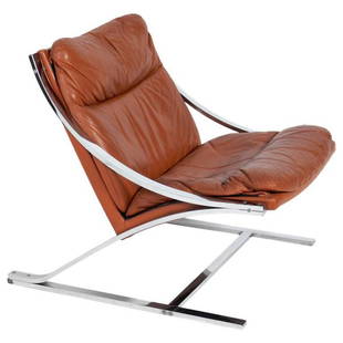 Paul Tuttle Cognac Leather and Chrome Zeta Chair: Sculptural "Zeta" model lounge chair, designed by Paul Tuttle for Strassle, unsigned, Switzerland, circa 1960s. This example retains its original cognac color leather and is perfectly broken in, retai