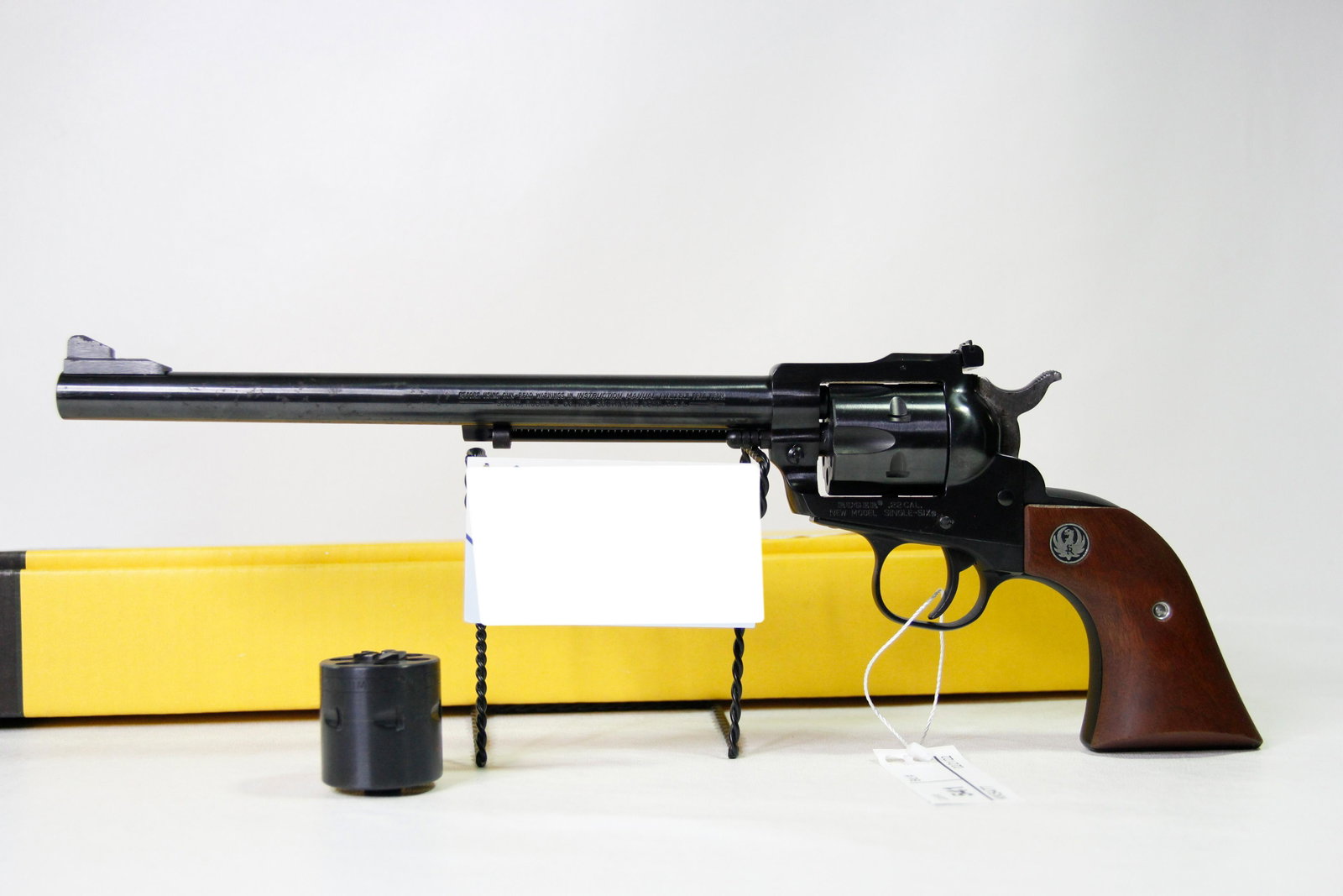RUGER NEW MODEL SINGLE SIX .22 CALIBER REVOLVER: Ruger New Model Single Six .22 caliber single action revolver. Barrel stamped "Strum, Ruger & Co, Inc - Southport Conn. USA". Frame stamped "Ruger .22 Cal. New Model - Single-Six". Ruger wood grips. C