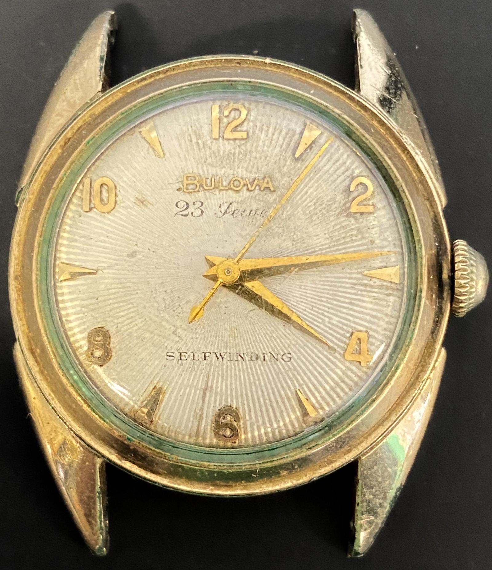 VINTAGE BULOVA 23 JEWELS GOLD FILLED AUTOMATIC MEN'S WATCH: VINTAGE BULOVA 23 JEWELS GOLD FILLED AUTOMATIC MEN'S WATCH The watch is pre-owned and runs. Diameter: 31mm (without the crown) *We can't garantee that the watch keeps accurate time, it wasn't tested l