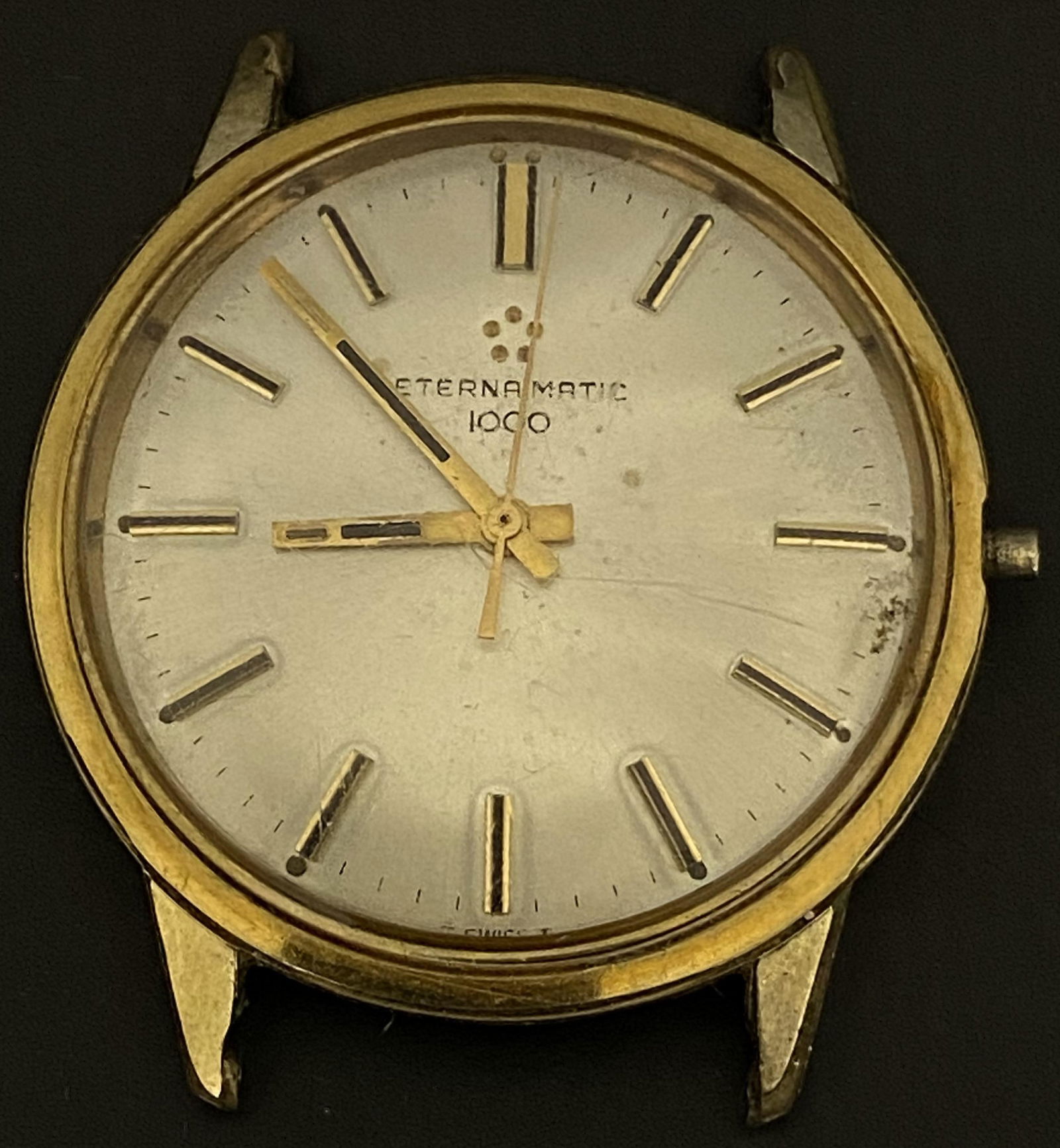 VINTAGE ETERNA-MATIC 1000 GOLD FILLED AUTOMATIC MEN'S WATCH: VINTAGE ETERNA-MATIC 1000 GOLD FILLED AUTOMATIC MEN'S WATCH The watch is pre-owned and runs.The crown is missing. Diameter: 35mm (without the crown) *We can't garantee that the watch keeps accurate ti