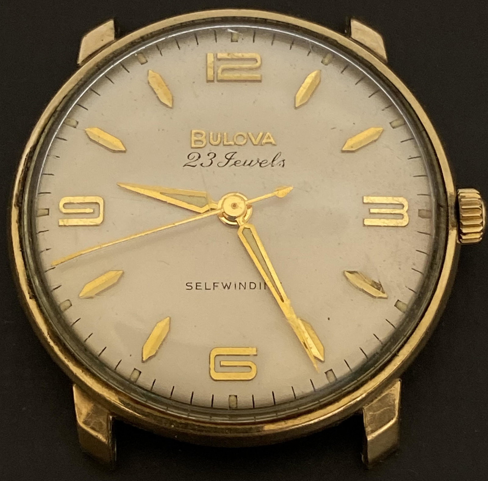 VINTAGE BULOVA 23 JEWELS GOLD FILLED AUTOMATIC MEN'S WATCH: VINTAGE BULOVA 23 JEWELS GOLD FILLED AUTOMATIC MEN'S WATCH The watch is pre-owned and runs. Diameter: 33mm (without the crown) *We can't garantee that the watch keeps accurate time, it wasn't tested l