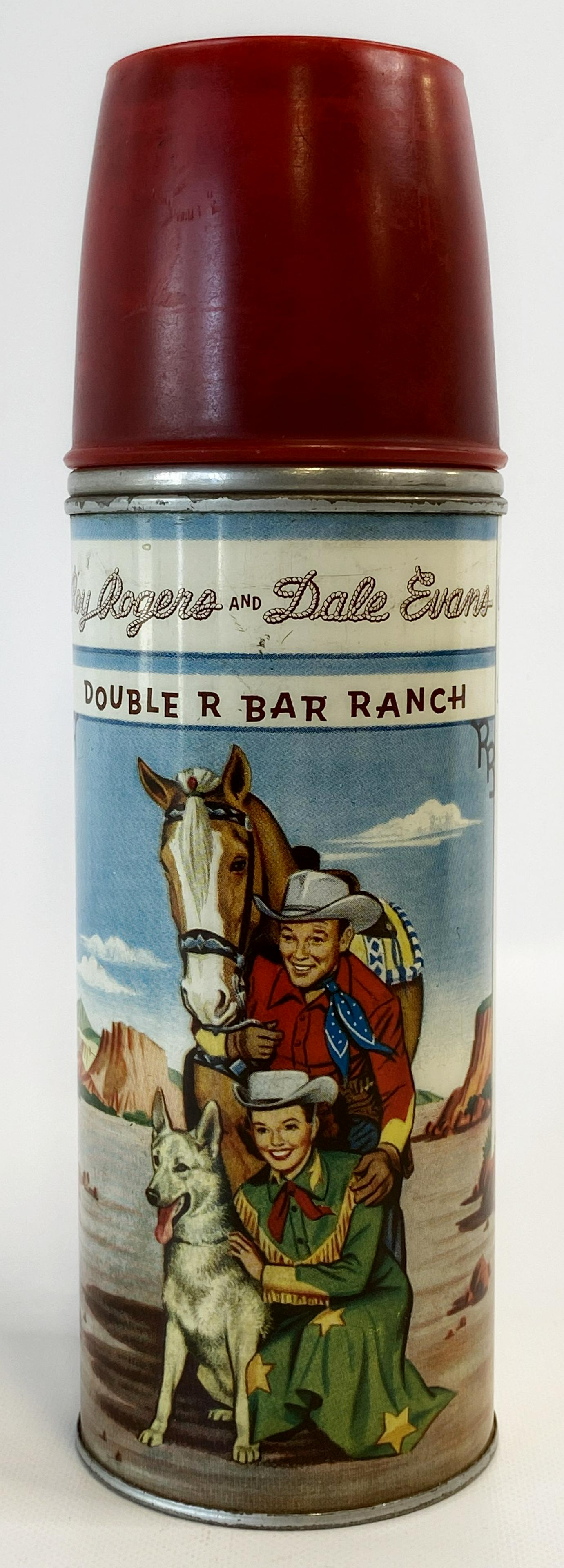 ROY ROGERS METAL THERMOS WITH RED TOP LID: ROY ROGERS METAL THERMOS WITH RED TOP LID The item is pre-owned. Size : 8 3/8 inches long SHIPPING FEE CANADA 15,00$ USA 20.00$ Combined shipping is available for an extra fee, but only on items won