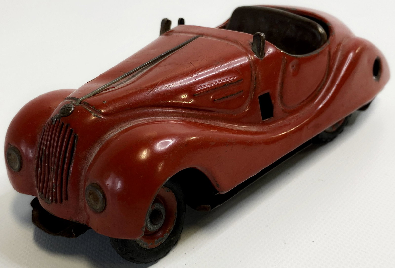 1950'S SCHUCO GERMANY WIND-UP TIN TOY CAR: 1950'S SCHUCO GERMANY WIND-UP TIN TOY CAR The toy is pre-owned. Size : 5 3/4 inches long SHIPPING FEE CANADA 15,00$ USA 20.00$ Combined shipping is available for an extra fee, but only on items won o