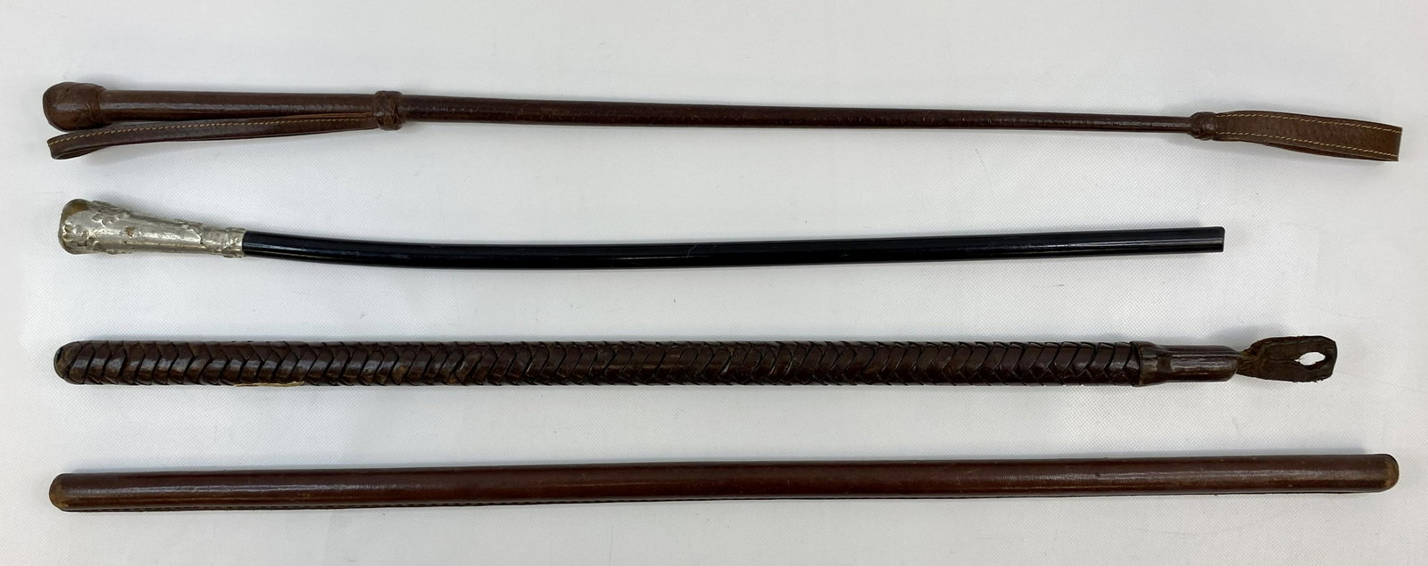 WW1 & WW2 CANADIAN ARMY SWAGER STICK LOT OF 4: WW1 & WW2 CANADIAN ARMY SWAGER STICK LOT OF 4 CONDITION: Pre-owned SIZE: 24 inches long SHIPPING FEE CANADA 20.00$ USA 25.00$ Combined shipping is available for an extra fee, but only on items won on 