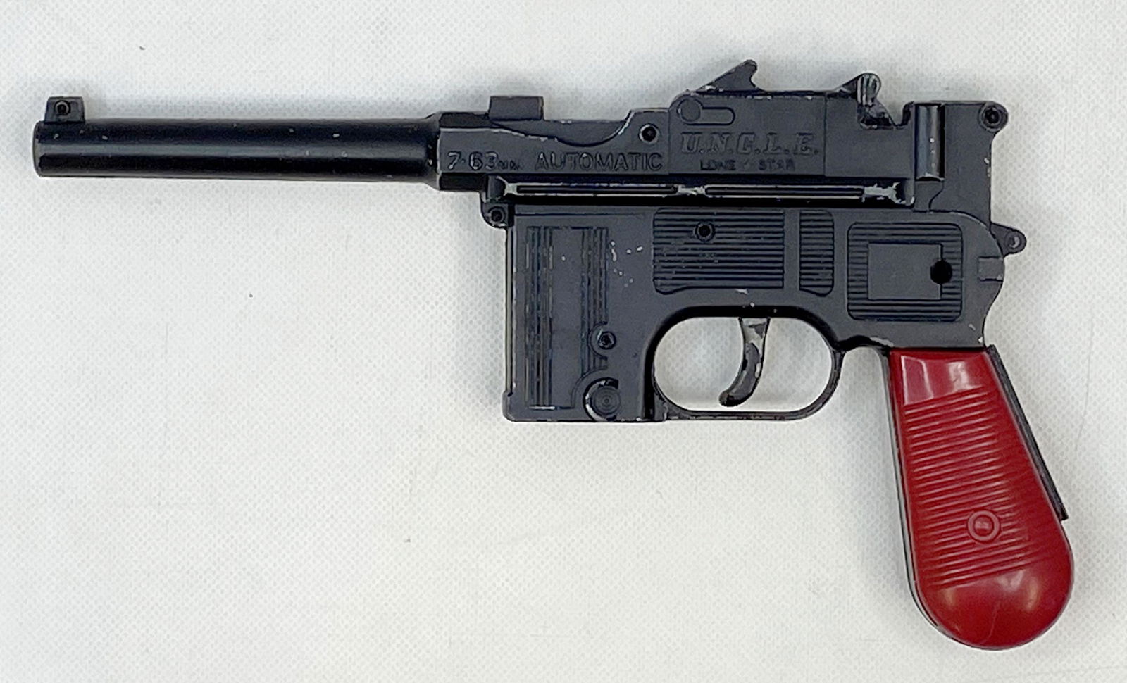 1960'S LONE STAR THE MAN FROM UNCLE 7.63 MM AUTOMATIC PISTOL TOY: 1960'S LONE STAR THE MAN FROM UNCLE 7.63 MM AUTOMATIC PISTOL TOY Condition: Pre-Owned. Size: 8 inches long. SHIPPING FEE CANADA 15.00$ USA 20.00$ Combined shipping is available for an extra fee, but o