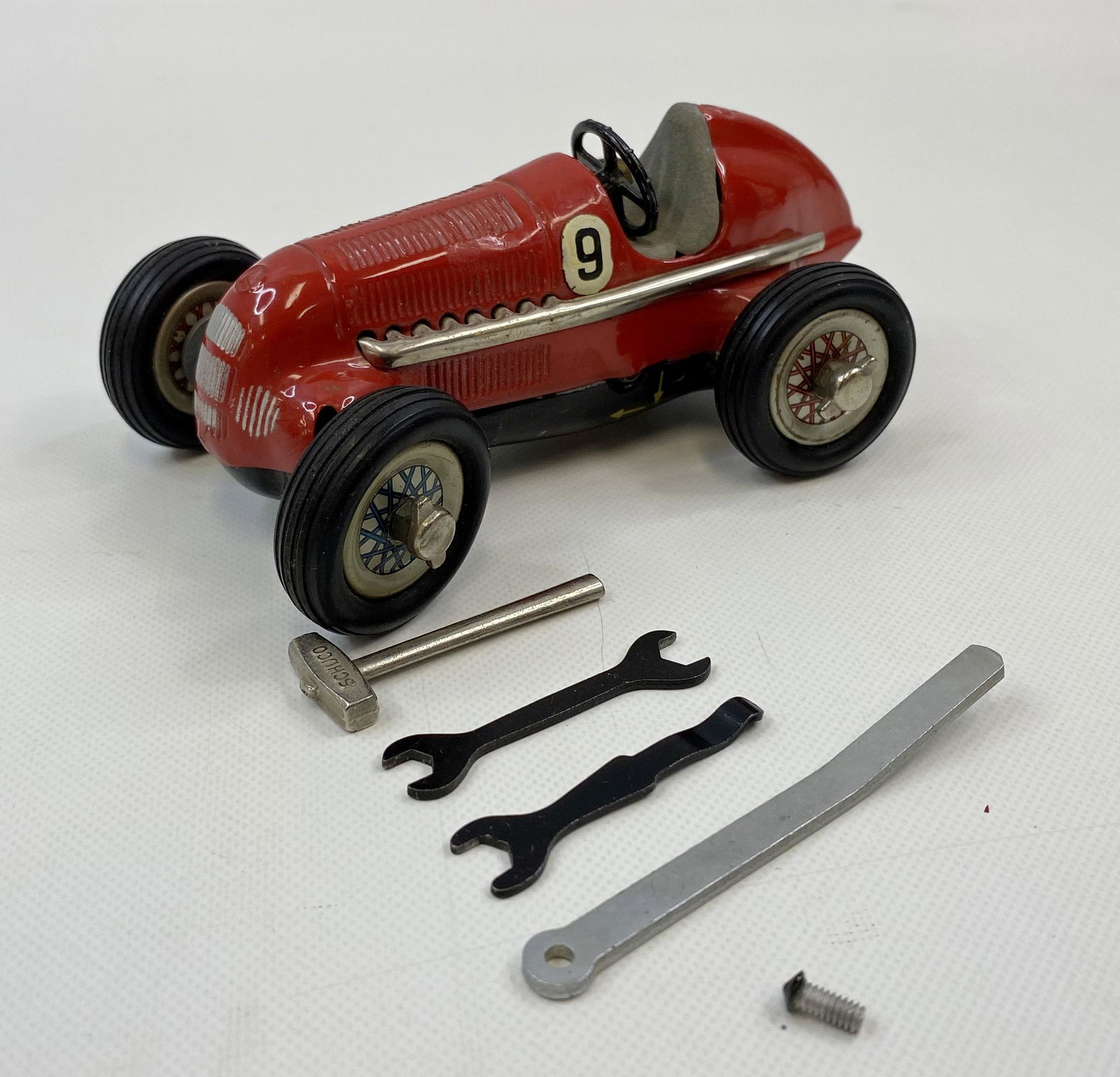 1950'S SHUCO GERMANY WIND-UP TIN TOY RACING CAR: 1950'S SHUCO GERMANY WIND-UP TIN TOY RACING CAR Condition: Pre-Owned. Size: 5 3/8 inches long. SHIPPING FEE CANADA 15.00$ USA 20.00$ Combined shipping is available for an extra fee, but only on items