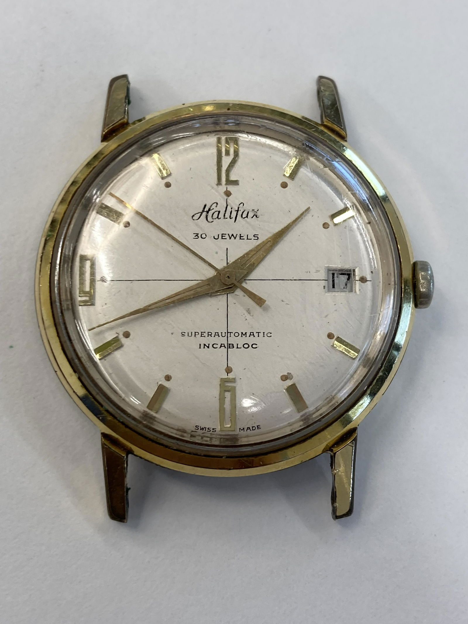 VINTAGE HALIFAX GOLD-FILLED AUTOMATIC MENS WATCH: VINTAGE HALIFAX GOLD-FILLED AUTOMATIC MENS WATCH CONDITION : PRE-OWNED - RUN Diameter: 34 MM *We can't garantee that the watch keeps accurate time, it wasn't tested long enough* SHIPPING FEE CANADA 1