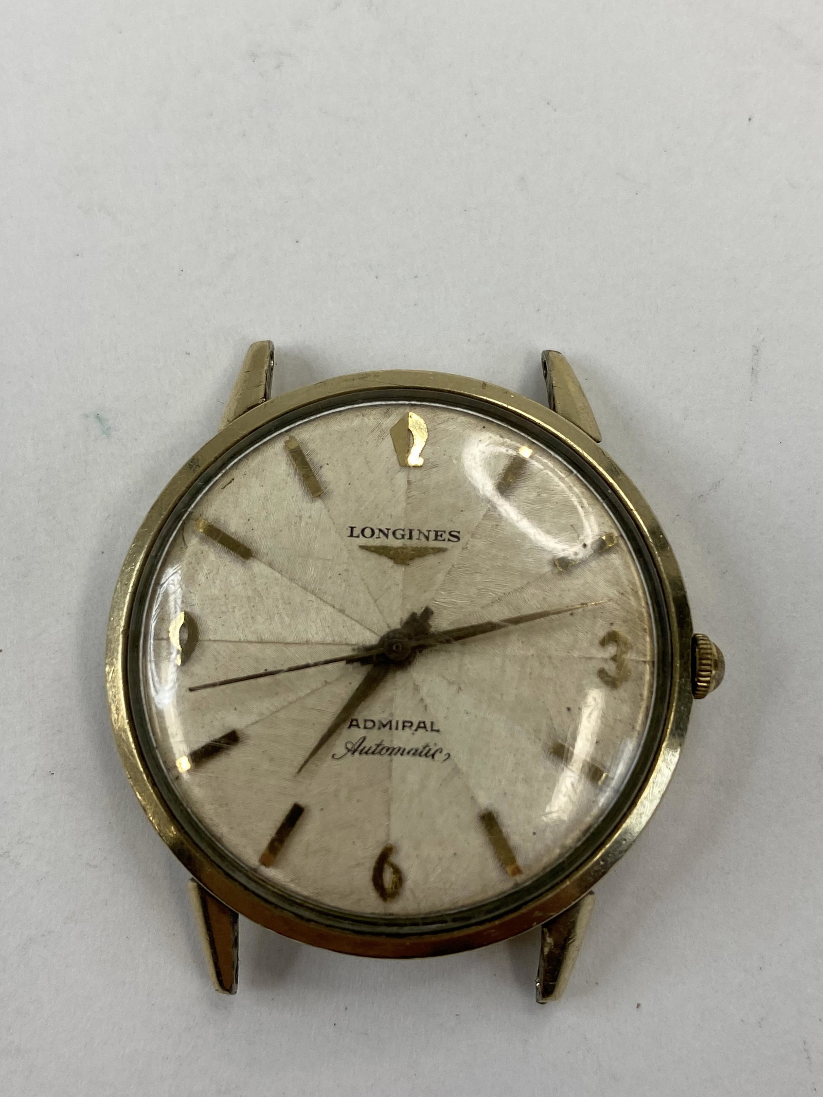 VINTAGE LONGINES ADMIRAL GOLD FILLED AUTOMATIC MEN'S WATCH: VINTAGE LONGINES ADMIRAL GOLD FILLED AUTOMATIC MEN'S WATCH CONDITION: PRE-OWNED / DOESN'T RUNS Diameter: 34 MM *We can't garantee that the watch keeps accurate time, it wasn't tested long enough* SHIP