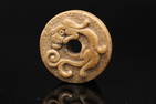 A Yellowish jade Bi disc, Han Dynasty (Bonhams London)