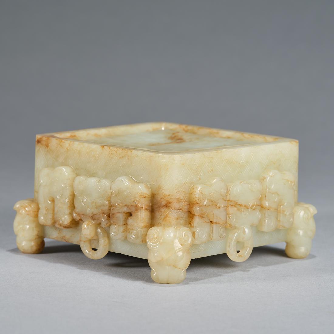 A white and Russet Jade Archaistic Duan Inkstone, Qing Dynasty (Private English Collection) (1 of 9)