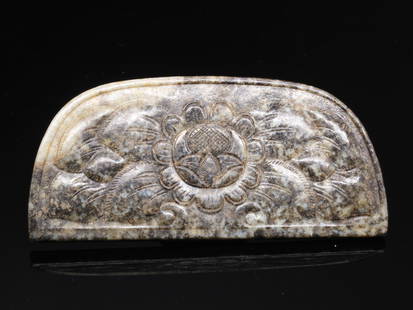 A rare pale celadon jade 'floral' comb-back, Tang Dynasty (Essex private collection): A rare pale celadon jade floral' comb-back, Tang Dynasty (Essex private collection) worked from pale celadon jade stone and delicately incised on both sides with floral bloom, the stone of pale celad