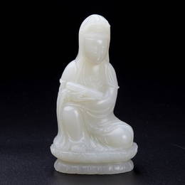 A white jade seated Guanyin, with woodstand, Mid Qing Dynasty (a countryside house in Essex County)