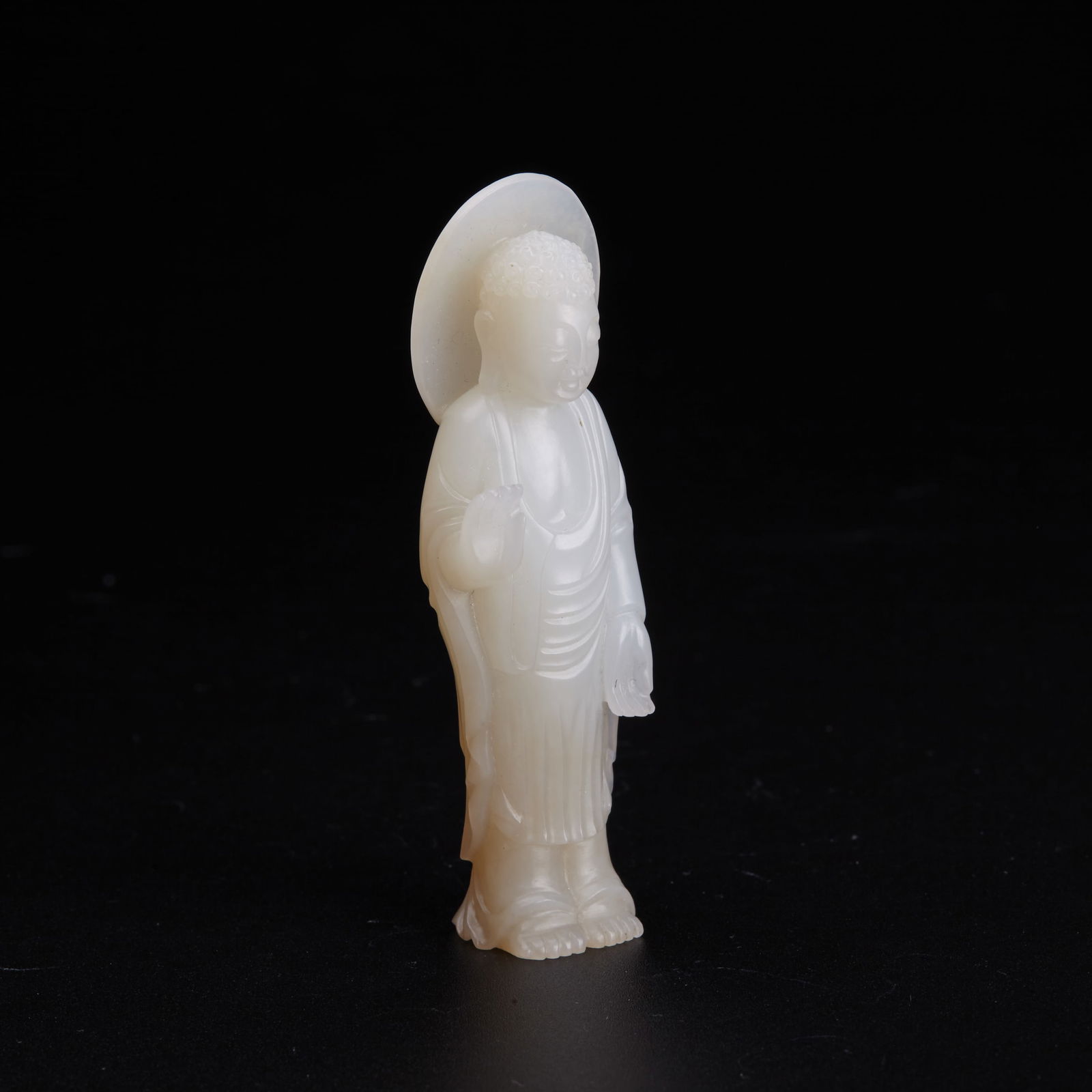A white jade carving of a standing Buddha, Qing Dynasty (Lyon & Turnbull) (1 of 7)