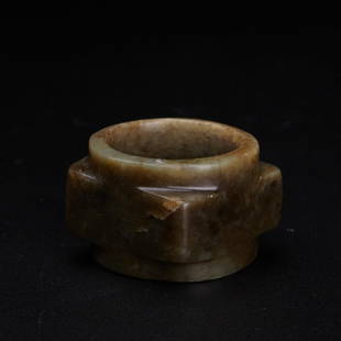 A celadon jade cong, Ming Dynasty (private English collection): A celadon jade cong, Ming Dynasty (private English collection) the one-tiered cong of square section with a central cylindrical aperture, the stone of olive green colour with even paler inclusions 