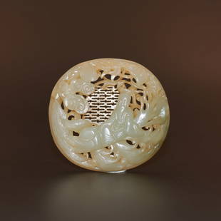 A reticulated pale celadon jade plaque, Ming Dynasty (private English collection): A reticulated pale celadon jade plaque, Ming Dynasty (private English collection) of oval shape, depicting a sage sitting on a gnarling tree above waves, ruyi clouds above him, all against a reticulat