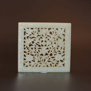 A pale celadon jade 'floral' plaque, Ming Dynasty (private English collection): A pale celadon jade 'floral' plaque, Ming Dynasty (private English collection) of square form, reticulated with stylised floral design, the stone of pale celadon tone Provenance: private English