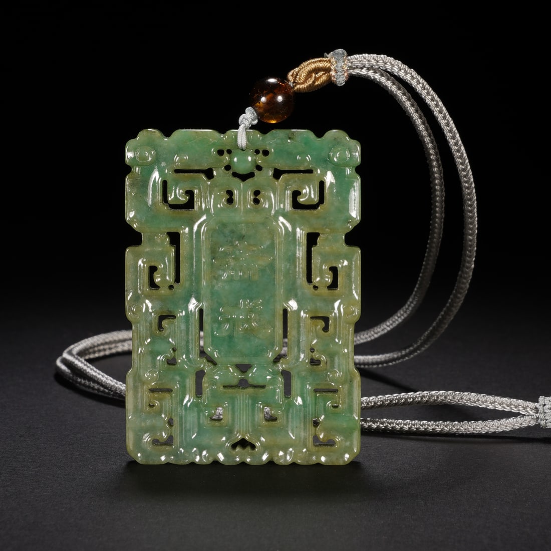 A jadeite openwork 'zhai jie, abstinence' plaque, Qing Dynasty (private English collection) (1 of 6)
