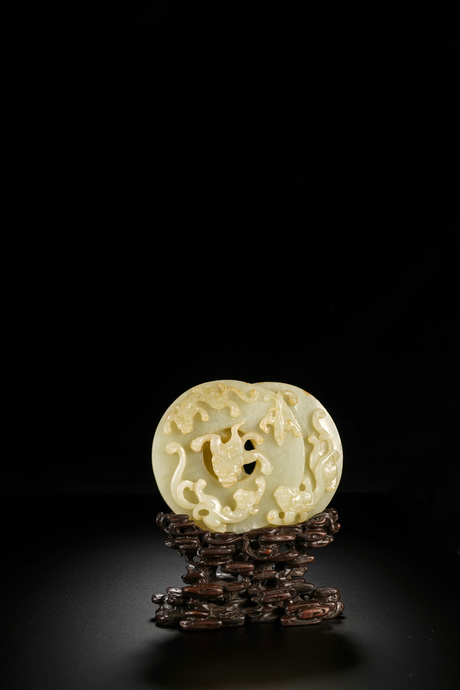A white jade 'chi dragon' double-bi disc carving, wood stand, Qing Dynasty (private English (1 of 5)