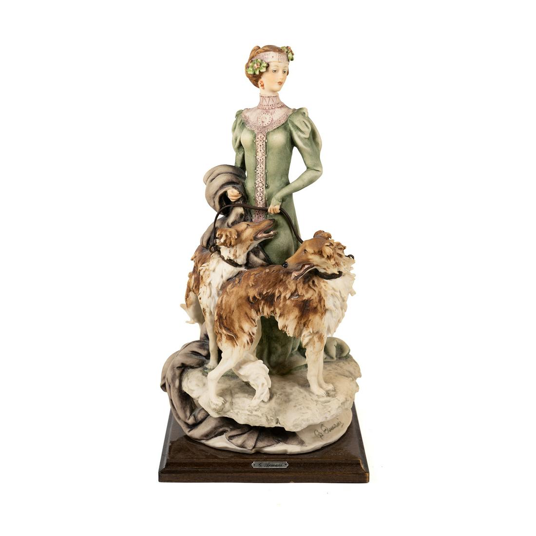 Giuseppe Armani Lady w/ Borzois Foxhounds Capodimonte: A Giuseppe Armani 'Lady with Borzois' depicting a lady with two foxhounds. Made in Florence - Giuseppe Armani (Italy)number 1122C issued in 1985 and marked "Florence G. Armani" with the Capodimonte "N