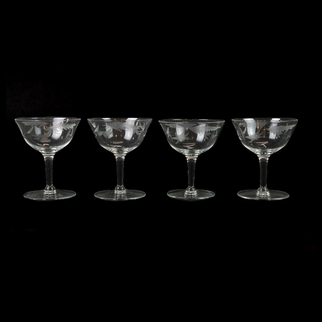 (4) Etched Flared Coupe Cocktail Glasses: A set of 4 cocktail coupe glasses having an etched floral motif and a flared rim.