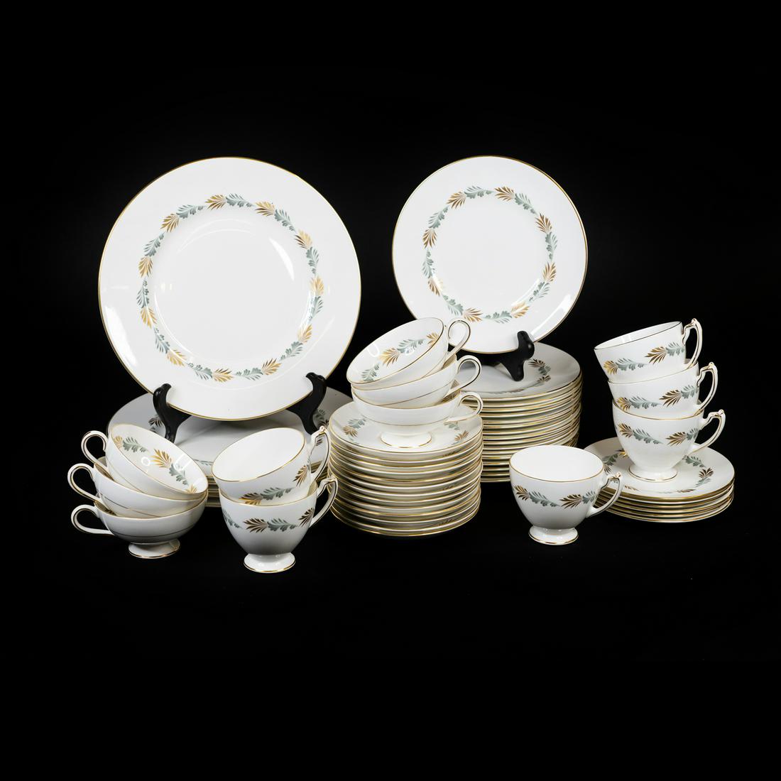 Coalport England 'Sonnet' China Set: A set of Coalport England bone china in the 'Sonnet' pattern having green and gold tone plume motif including 6 dinner plates, 17 salad plates, 6 bread and butter plates, 13 saucers, 6 teacups, 6 coff