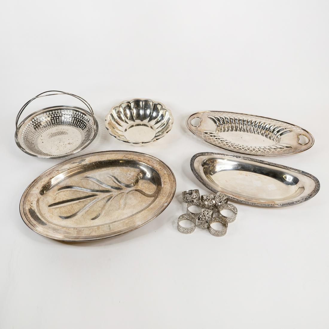 (6) Silverplate Serveware Dishes incl Reed & Barton: A group of (6) six silverplate serveware dishes including Reed & Barton 175 Holiday, pierced candy dish with handle, Roger Bros elongated boat dish, pierced elongated boat dish, and embossed large foo