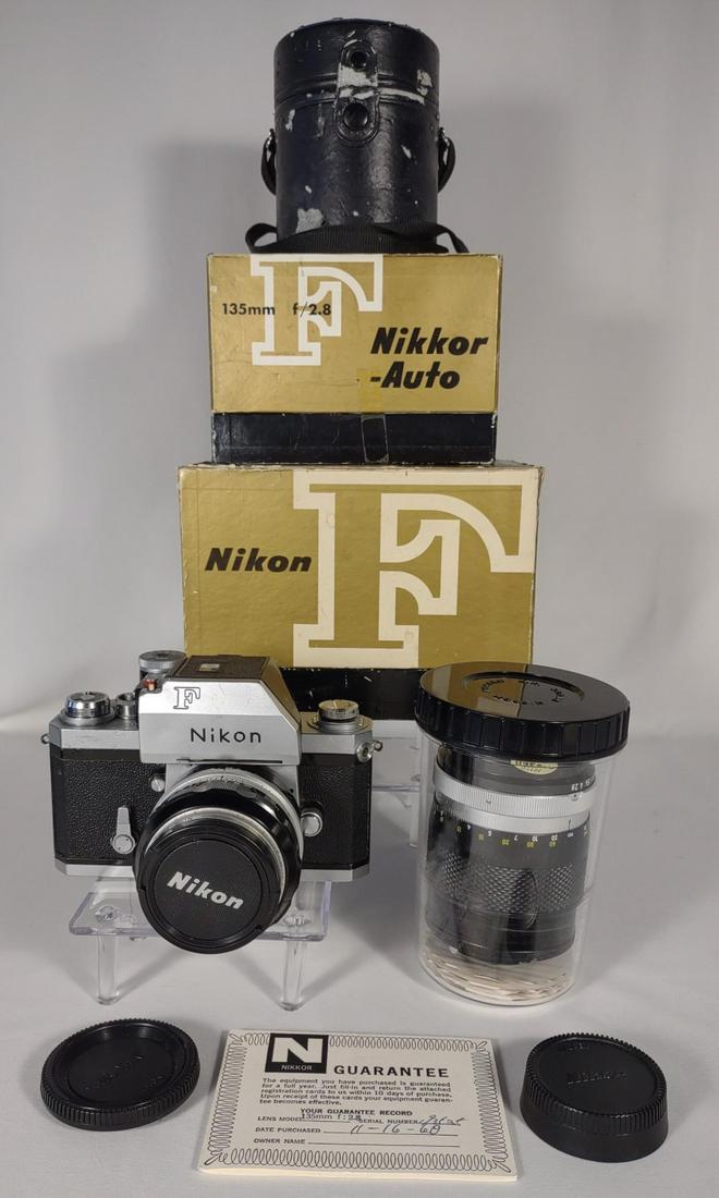 Nikon F Camera w/ 2 Lenses & Original Boxes: Includes Nikon F camera, Nikon ND 4X 52mm Lens with case, and Nikkor Auto 135MM f/2.8 lens (good condition). Also includes original box with manuals for Nikon camera and original box for the 135mm len