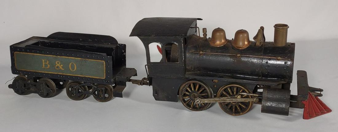 Voltamp 2200 Locomotive & 2102 B&O Tender: Antique Voltamp #2200 Locomotive train engine with Voltamp #2102 B & O tender car. Circa early 1900s. Untested. Top shell of engine removes from base. Missing front plate. Tender is good with a few pa