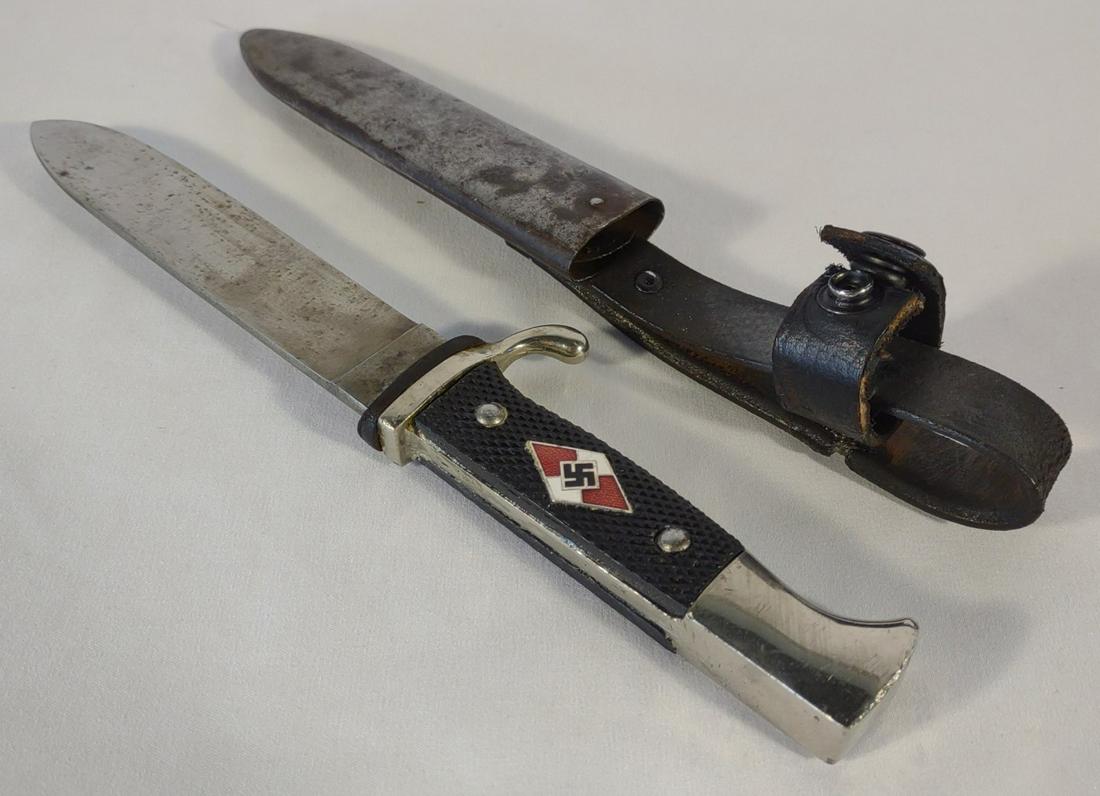 WWII German Hitler Youth Dagger w/ Scabbard: World War 2 German Hitler Youth dagger knife with metal and leather scabbard. Unmarked blade and scabbard. 5.5" blade. 10" total length with scabbard.
