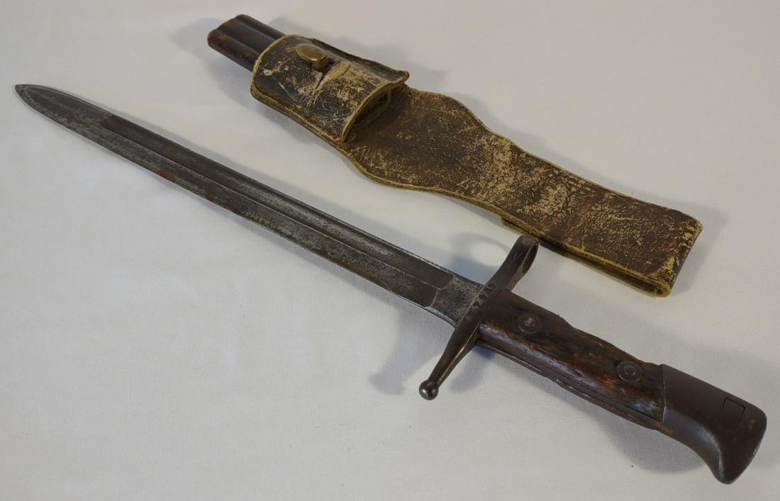 WWII Italian Terni Bayonet & Scabbard: World War 2 Italian Terni M1891 Carcano bayonet with brass and leather scabbard. The ricasso of the bayonet is marked "Terni" and "1E7929". The scabbard has been cut short. Scabbard is marked "A.R.E.T