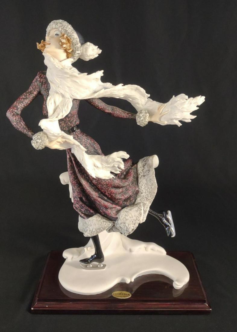 Giuseppe Armani Ice Skater Lady Figurine: Giuseppe Armani, Florence Italy, 1989. Capodimonte. Stands 15" tall. Made by Giuseppe Armani Figurines. Depicts woman ice skating swiftly while her scarf blows in the wind. No chips or cracks. The bac