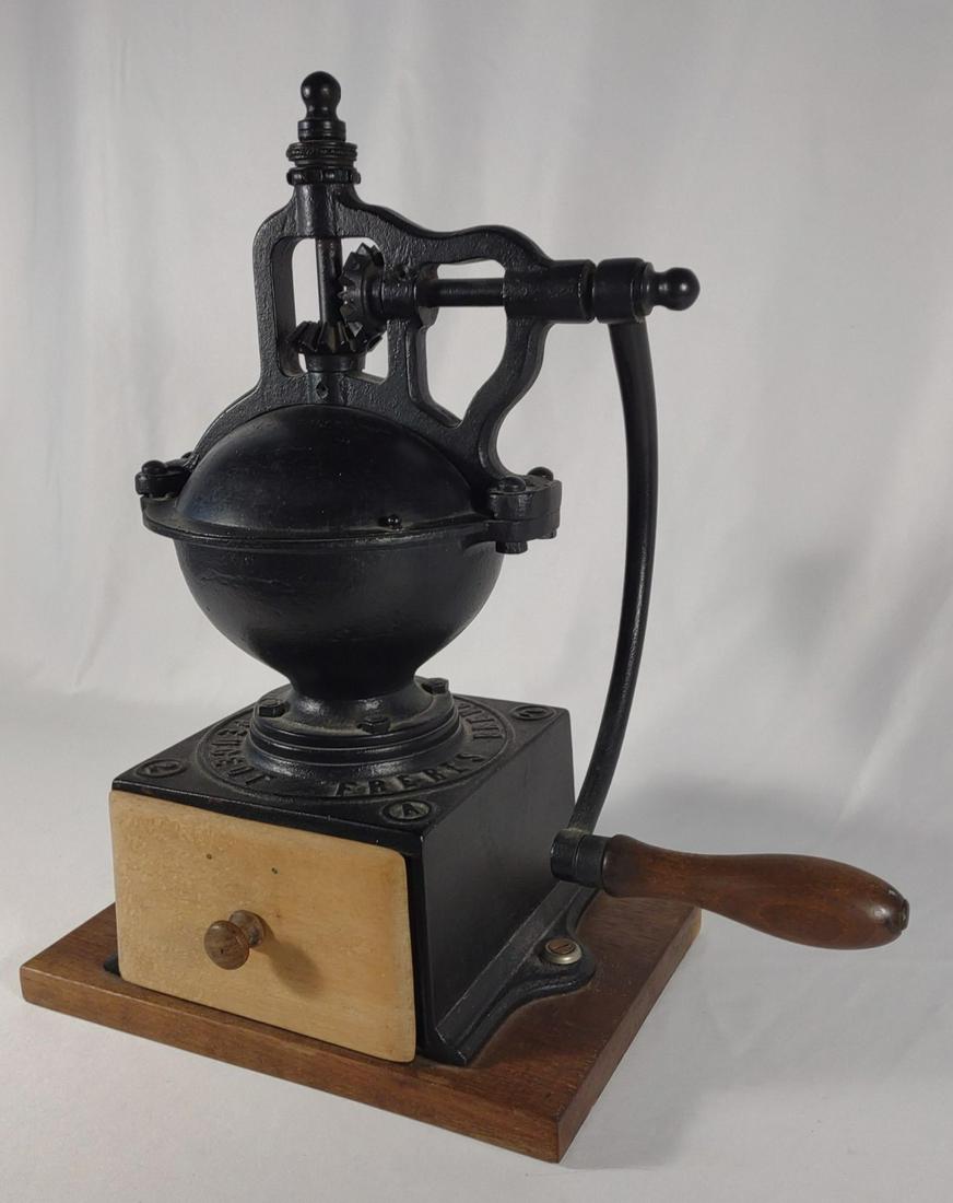 French Peugeot Freres Cast Iron Coffee Grinder: Circa 1880-1900. Antique cast iron french hand crank coffee grinder. Number 2. "Peugeot Freres Brevete SGDG". In nice, working condition.
