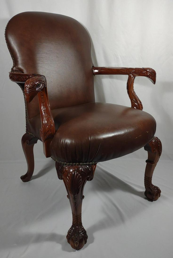 Mahogany Carved Eagle Arm Chair w/ Leather: English Georgian style mahogany carved eagle arms and claw foot with brown leather upholstery. Beautiful eagle head and feather pattern carved into arms with claw and ball detail on front legs. Right 