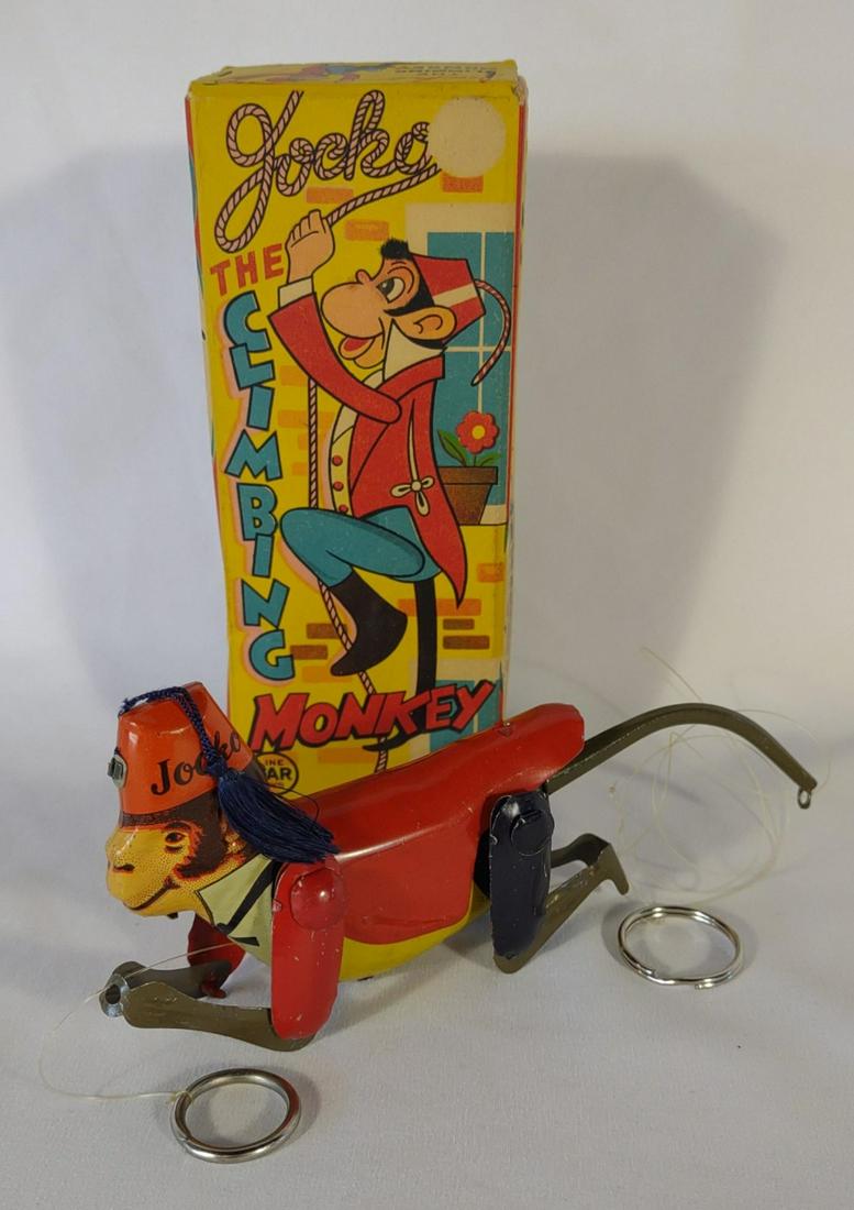 Linemar Tin Jocko the Climbing Monkey Toy w/ Box: Vintage Jocko The Climbing Money tin litho toy in original box. Working condition. Made by Linemar toys, Japan.