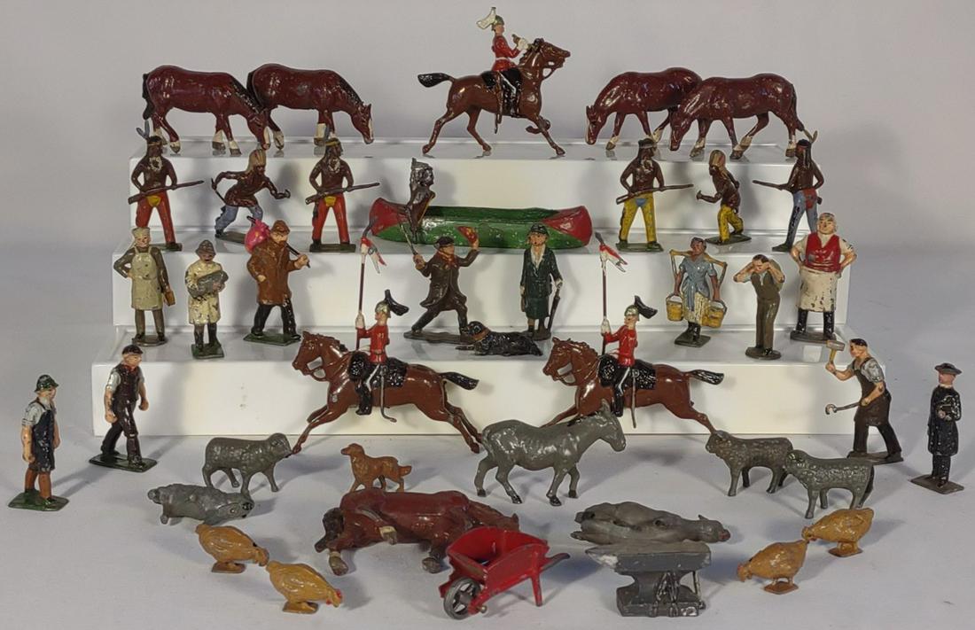 Britains LTD & England Lead Toy Figurines: This is a mixed lot of both "England" marked and Britains LTD lead toy sets. The canoe native american figure is marked "France". Vintage and antique toy lead figures.