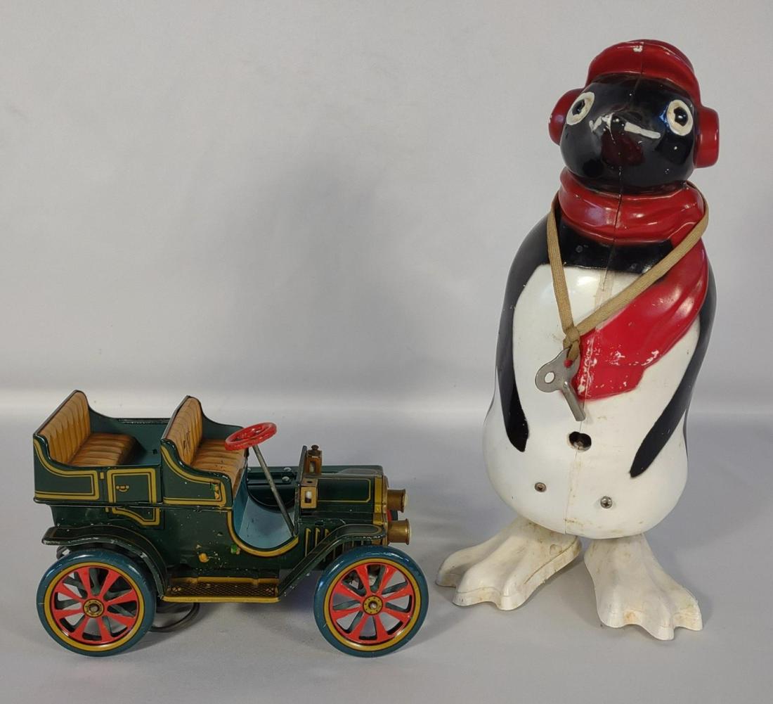 Japan Tin Model T Toy Car & Wind Up Penguin w/ Key: Vintage Trade Mark Modern Toys Japan battery operated tin litho Model T car. Vintage plastic wind up waddling penguin toy with key. Tested and works.