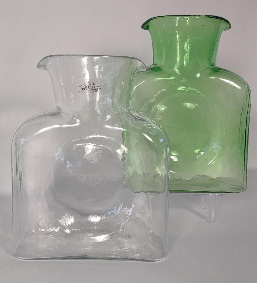 2 Blenko Glass Art Water Pitchers: Both are handmade by Blenko glass.