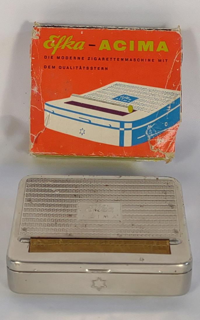 WWII German Automatic Cigarette Rolling Machine: World War 2 german automatic cigarette rolling box / case with original box slip. Made by Efka-Acima. Original box has wear on corners. Cigarette machine is good and appears to be in unused condition.
