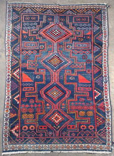 Antique Persian Iran Rug 6'3" x 4'5": 6' 3" x 4' 5". Antique Persian rug with blue, red and cream colored geometric triangular patterns throughout. "Made in Iran" tag on back. One corner edge of rug has fraying present.