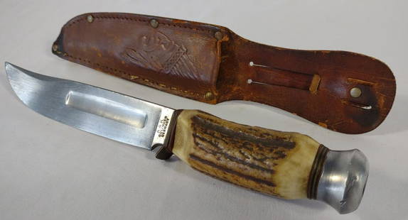 German A & K Solingen Stag Handle Knife w/ Sheath: Vintage German stag handle fixed blade knife with leather sheath. Ricasso of blade is marked "A & K Solingen, Germany". Brass finger guard has been bent. Blade length: 6". Overall knife length: 10". L