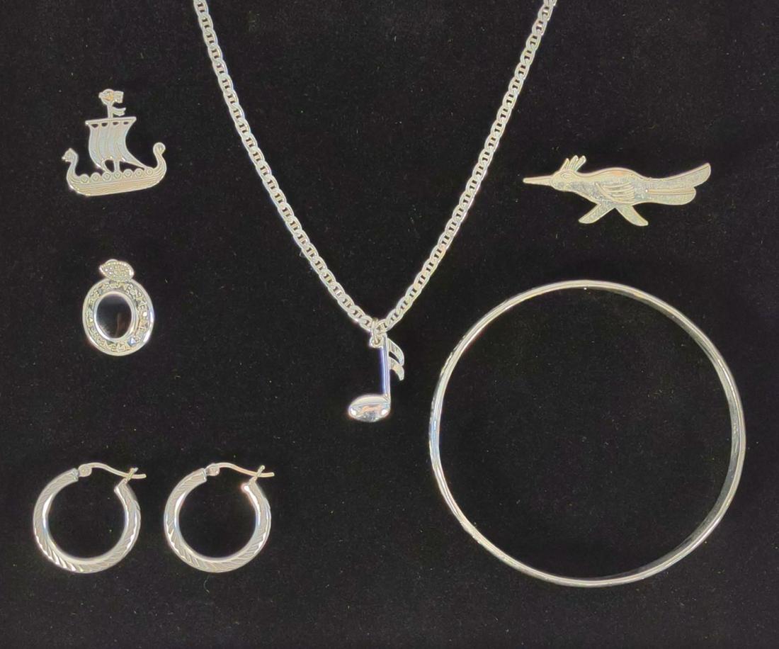 Sterling Silver Bangle, Necklace, Earrings & More: This sterling silver jewelry set includes 1 bangle bracelet, 1 bird pin, 1 pair of earrings, 1 necklace chain, and 3 pendants, including Viking ship, black polished stone, and music note. All are ster