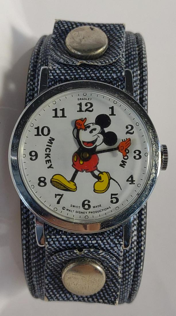 1970s Bradley Mickey Mouse Windup Watch (Works): Vintage Bradley swiss made windup Mickey Mouse wrist watch. Walt Disney Productions. Circa 1970s. Pie eye mickey. The back is marked 23. Winds up and ticks.