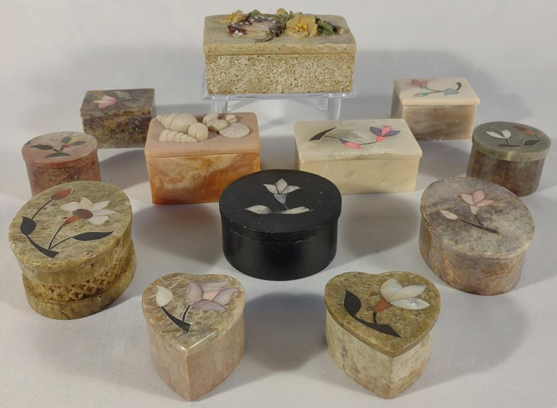 12 Soapstone & Mother Of Pearl Trinket Boxes: A collection of vintage soapstone and mother of pearl inlaid trinket boxes with lids. Each both is inlaid with a floral pattern.